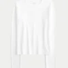 Långärmad sömlös baby-T-shirt i stretchig trikå