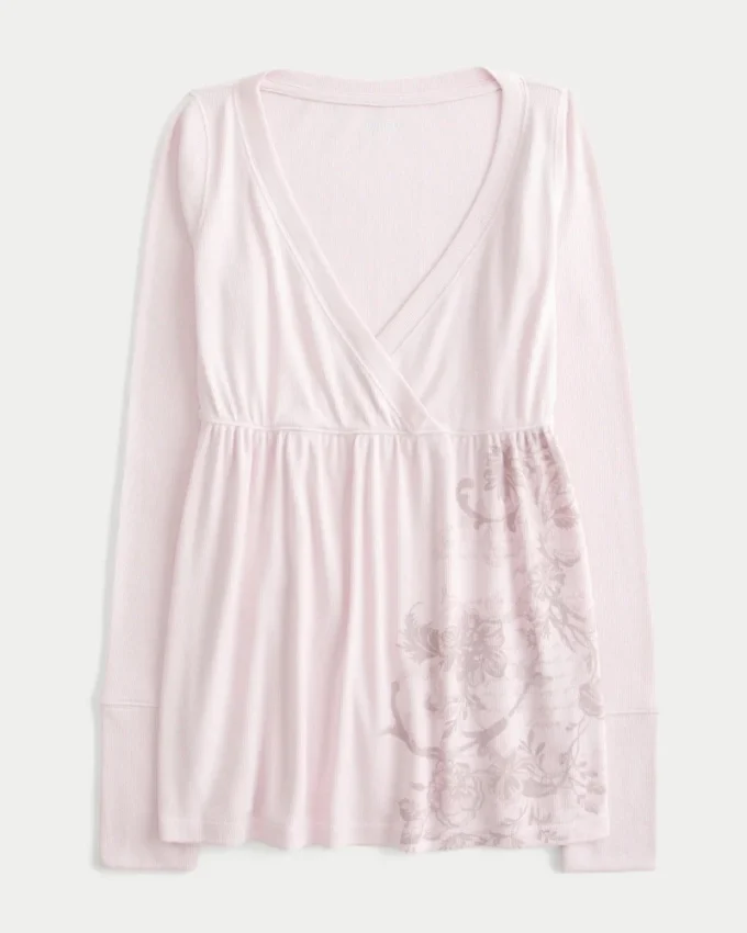 Lätt babydoll-top med långa ärmar och blommönster Lätt babydoll-top med långa ärmar och blommönster