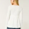 Lätt långärmad babydoll-top i pointelle