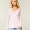 Lätt långärmad babydoll-tröja med omlottfront Lätt långärmad babydoll-tröja med omlottfront