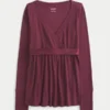 Lätt långärmad babydoll-tröja med omlottfront Lätt långärmad babydoll-tröja med omlottfront