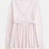 Lätt långärmad babydoll-tröja med omlottfront Lätt långärmad babydoll-tröja med omlottfront