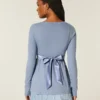 Lätt långärmad babydoll-tröja med omlottfront Lätt långärmad babydoll-tröja med omlottfront