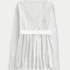 Lätt långärmad babydoll-tröja med omlottfront Lätt långärmad babydoll-tröja med omlottfront