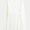 Lätt långärmad babydoll-tröja med omlottfront Lätt långärmad babydoll-tröja med omlottfront