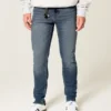 Mediumtvättade atletiska skinny jeans