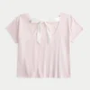 T-shirt med blommönster och enkel rosettknut