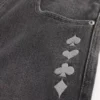 Tvättade svarta skaterjeans med joker-motiv Tvättade svarta skaterjeans med joker-motiv