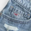 Ultra låg midja broderade denimminishorts