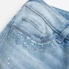 Ultra låg midja, slitna, ljus tvättade jeans med paljetter Ultra låg midja, slitna, ljus tvättade jeans med paljetter