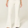 Ultra låg midja vita broderade fickor flare jeans Ultra låg midja vita broderade fickor flare jeans