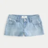 Ultralåga slitna minishorts i mediumtvättad denim